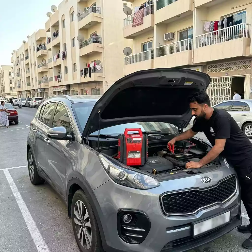 Car Battery Squad technician doing Jump Start service in Dubai